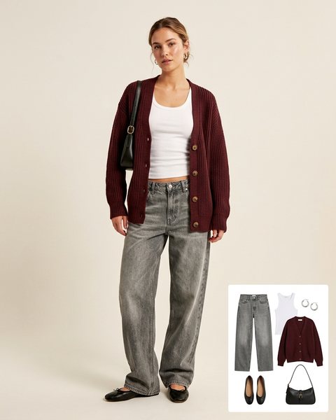 Woman wearing grey-wash slouchy jeans with a white ribbed tank, a burgundy cardigan, black ballet flats and a black shoulder bag