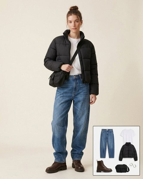 Woman wearing dark brown lug-sole lace-up boots with baggy jeans, a white tee, a cropped black puffer jacket and a black crossbody bag