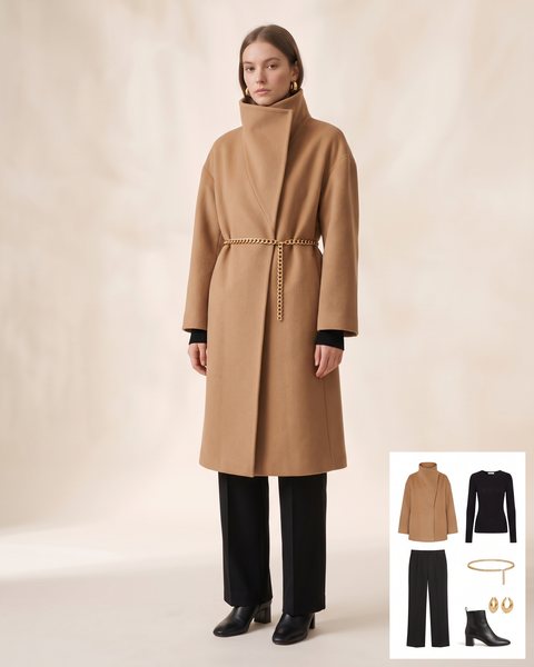 Oversized camel wool coat with a high funnel collar, black wide-leg trousers and a gold chain belt at the waist