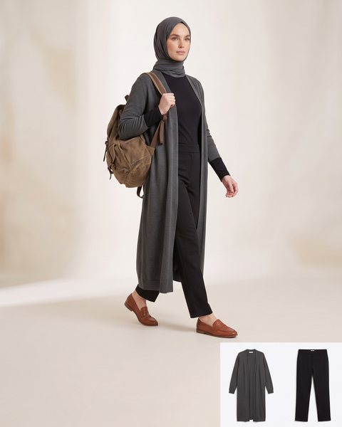 Long open-front duster cardigan layered over straight-leg trousers, styled for campus