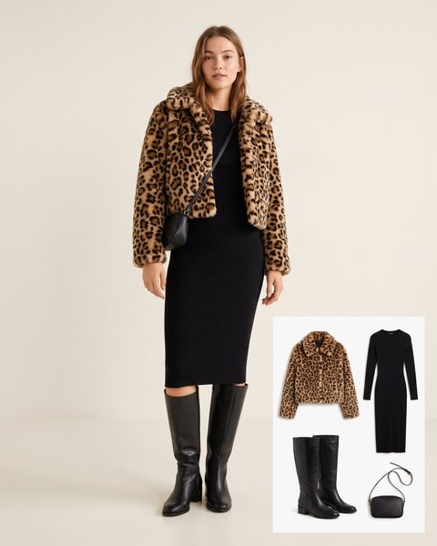 Woman wearing a cropped leopard print faux fur jacket over a black fitted ribbed-knit midi dress with black knee-high leather boots and a small black crossbody bag