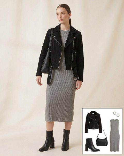 Woman wearing a black suede moto jacket with a grey ribbed midi dress, black block-heel ankle boots and a black shoulder bag